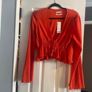 Cropped tie bell sleeve top